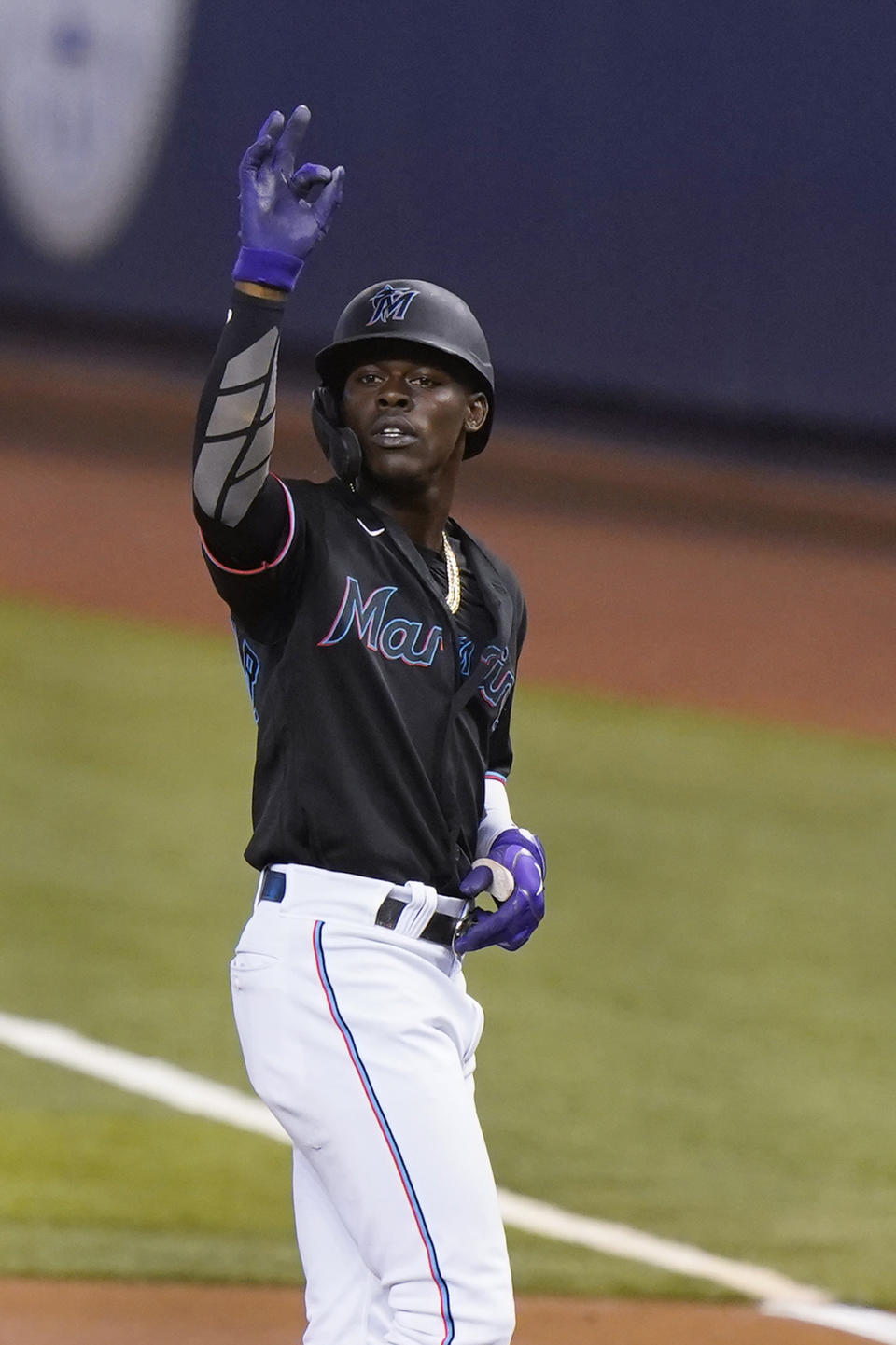 Miami Marlins' Jazz Chisholm Jr. celebrates after getting a base hit during the first inning of a baseball game against the Atlanta Braves, Friday, June 11, 2021, in Miami. (AP Photo/Wilfredo Lee)