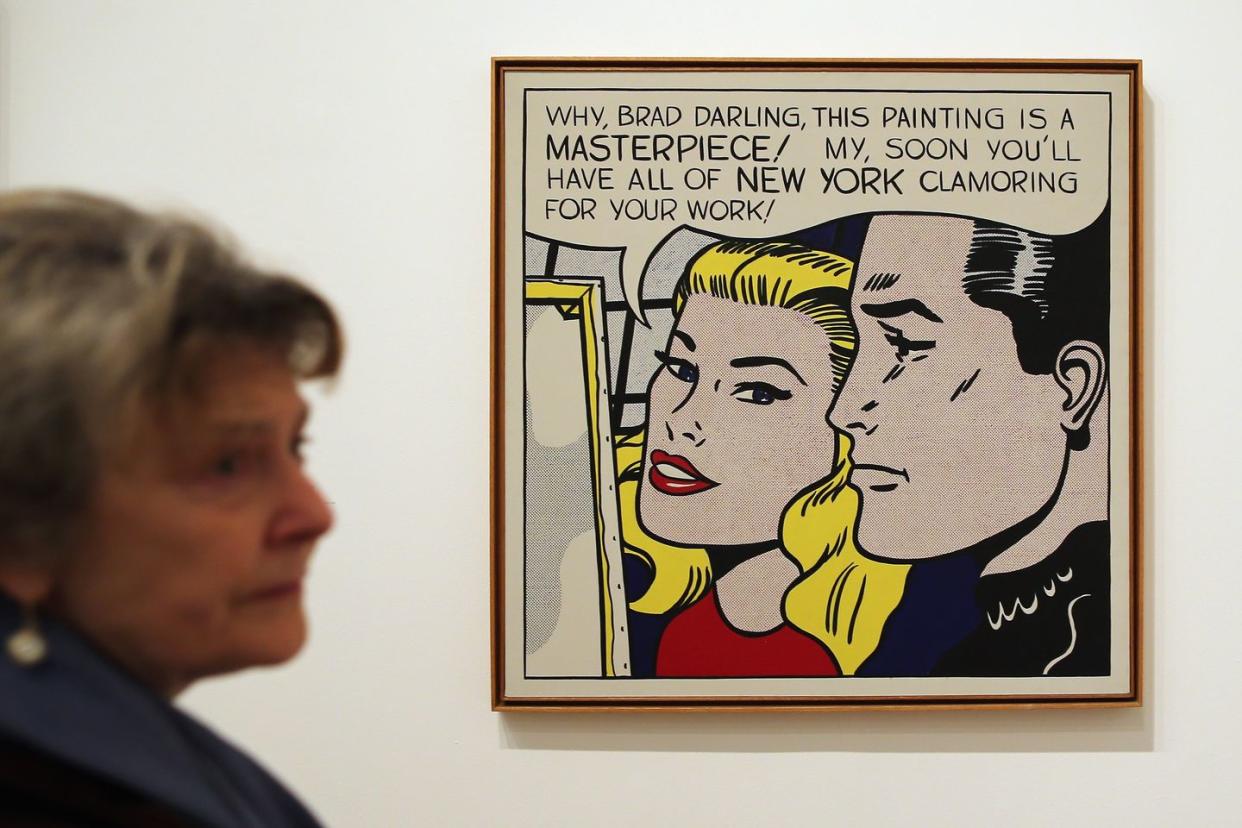 london, england february 18 a visitor stands in front of a painting entitled masterpiece, during a press preview of lichtenstein, a retrospective at the tate modern on february 18, 2013 in london, england the painting is part of a retrospective exhibition by 1960s pop artist roy lichtenstein, the first of its kind in 20 years, which runs at the gallery until may 27, 2013 photo by dan kitwoodgetty images