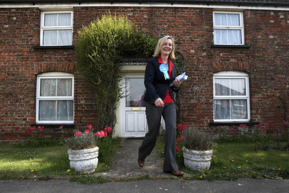 File - Conservative Parliamentary candidate for South West Norfolk Elizabeth Truss, canvasses in the village of West Walton, in Norfolk, during the 2010 General Election campaign, April 29, 2010. Britain's new leader, Liz Truss, is the child of left-wing parents who grew up to be an admirer of Conservative Prime Minister Margaret Thatcher. Now she is taking the helm as prime minister herself, with a Thatcherite zeal to transform the U.K. One colleague who has known Truss since university says she is “a radical” who wants to “roll back the intervention of the state” in people’s lives, just as Thatcher once did. (Chris Radburn/PA via AP, File)