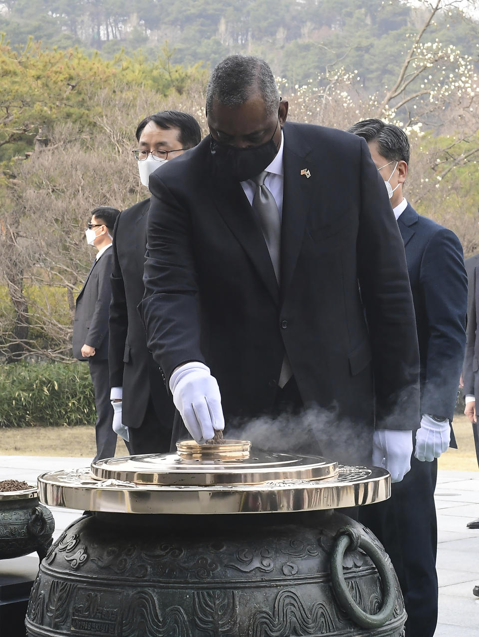 U.S. Defense Secretary Lloyd Austin burns incense to pay tribute to the victims of the Korean War during his visit to the National Cemetery Thursday, March 18, 2021, in Seoul, South Korea. (Kim Min-hee/Pool Photo via AP)