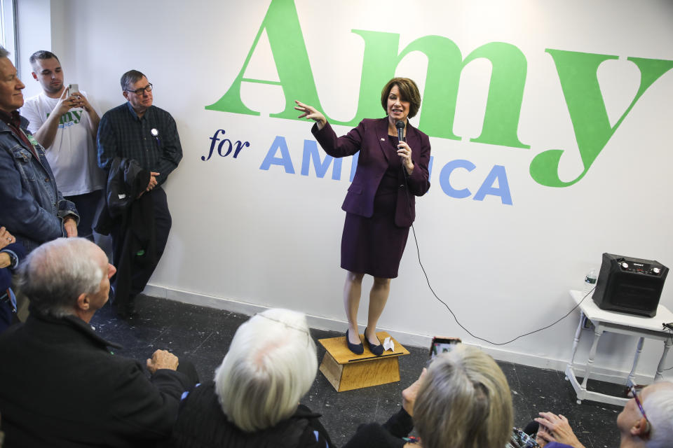 MANCHESTER, NH - OCTOBER 6: U.S. Senator and presidential candidate Amy Klobuchar stands on a step stool while she speaks to dozens of potential voters in her Manchester, NH campaign office on Oct. 6, 2019. Following the release of her first TV ad, All of America, Senator Amy Klobuchar returned to New Hampshire on Sunday to open her field office in Manchester. (Photo by Erin Clark for The Boston Globe via Getty Images)