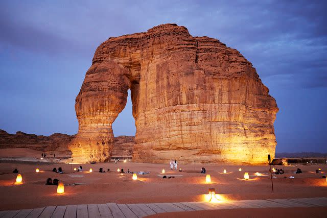 <p>xavierarnau/Getty Imagees</p> Twilight at Elephant Rock in Alula, Saudi Arabia.