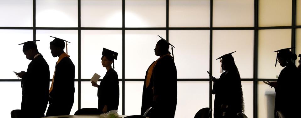 Graduates line up to have their official portraits taken at Shelton State before the spring commencement on May 5, 2023. Nearly 200 graduates participated in the ceremony.