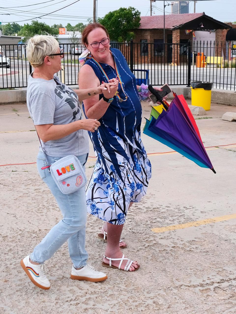 Sara Cunningham, founder of Free Mom Hugs, left, dances with Diana Lettkeman at the OKC Pride opening ceremony in May 2023 in Oklahoma City.