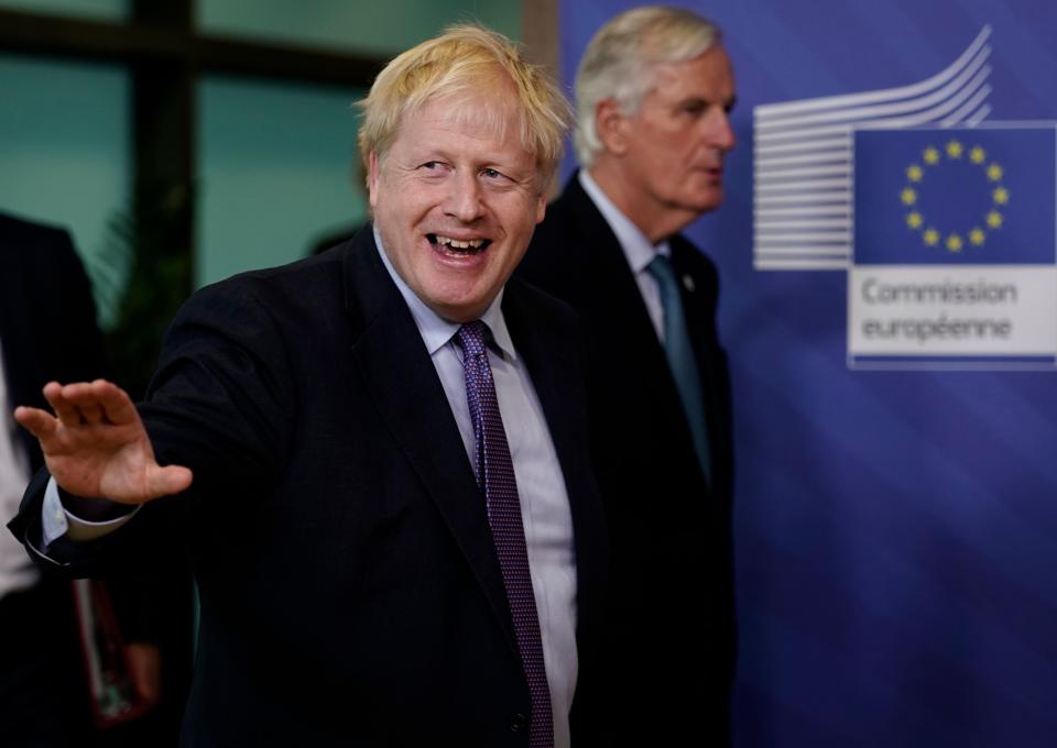 British Prime Minister Boris Johnson (L) gestures as he walks with EU chief Brexit negotiator Michel Barnier as they prepare to address a press conference at a European Union Summit at European Union Headquarters in Brussels on October 17, 2019. (Photo by Kenzo TRIBOUILLARD / AFP) (Photo by KENZO TRIBOUILLARD/AFP via Getty Images)