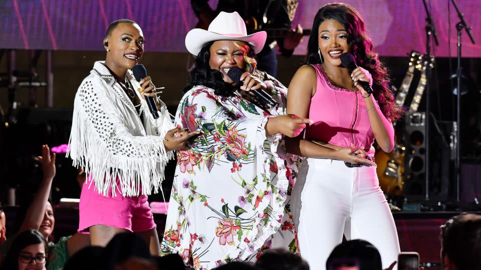 (From left) Trea Swindle, Danica Hart and Devynn Hart of Chapel Hart perform at the CMT Music Awards in Austin, Texas. - Evan Agostini/Invision/AP