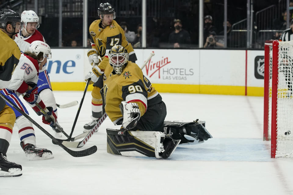 Montreal Canadiens left wing Michael Pezzetta (55) scores on Vegas Golden Knights goaltender Robin Lehner (90) during the first period of an NHL hockey game Thursday, Jan. 20, 2022, in Las Vegas. (AP Photo/John Locher)