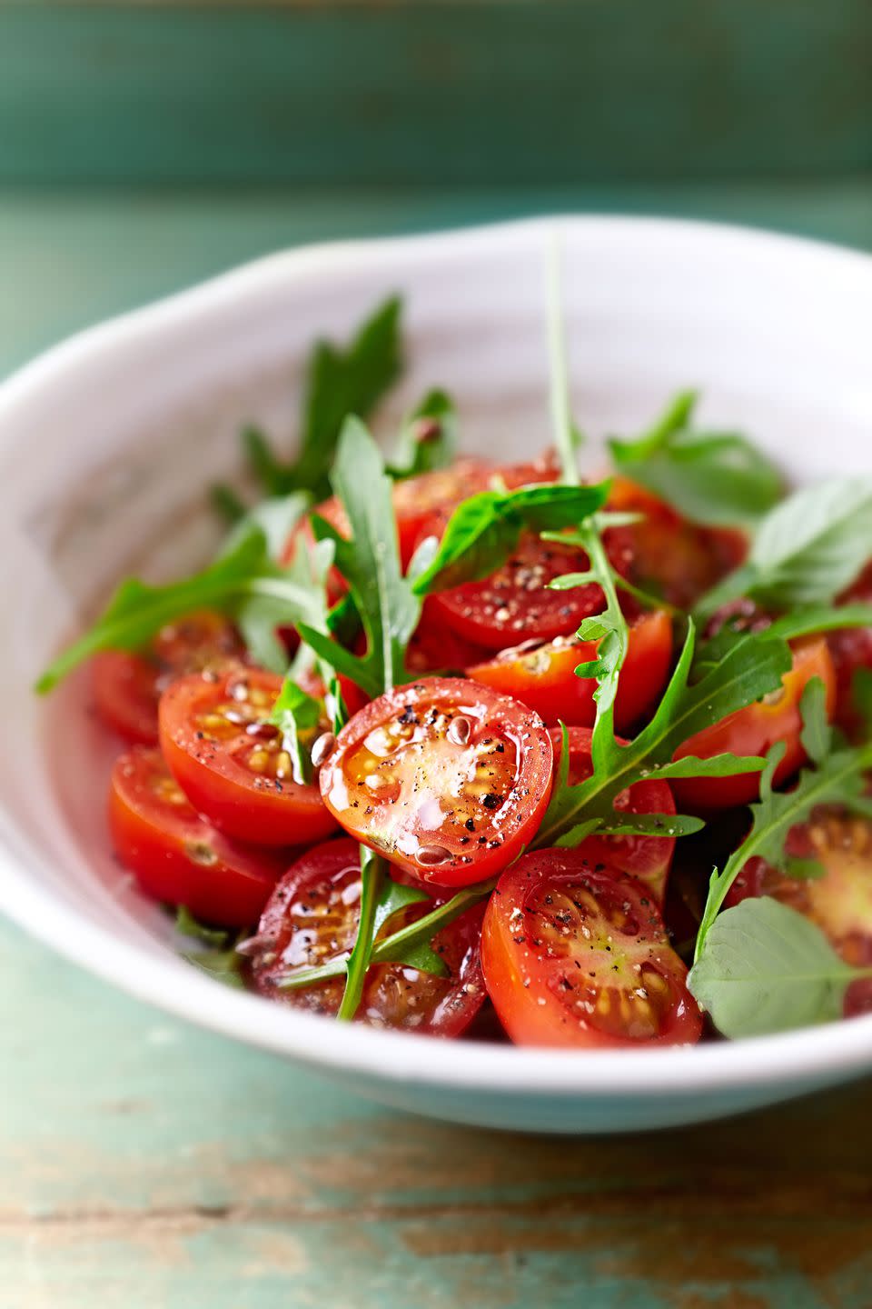 Cut a bunch of cherry tomatoes at once with lids.