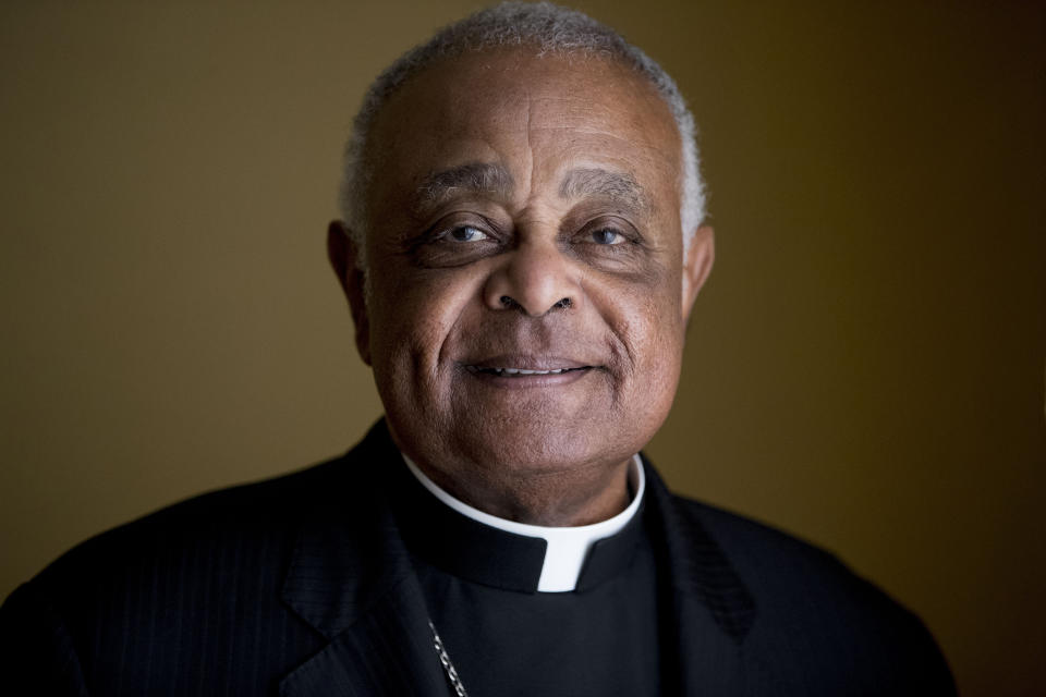 FILE - This Sunday, June 2, 2019, file photo shows Washington D.C. Archbishop Wilton Gregory posed for a portrait following mass at St. Augustine Church in Washington. Gregory, who is undergoing quarantine at the Santa Marta hotel before Saturday's consistory, said that while he was unable to go out, at least he was able to get his new red cassock delivered from Rome’s famous clerical haberdasher, Gammarelli. (AP Photo/Andrew Harnik, File)