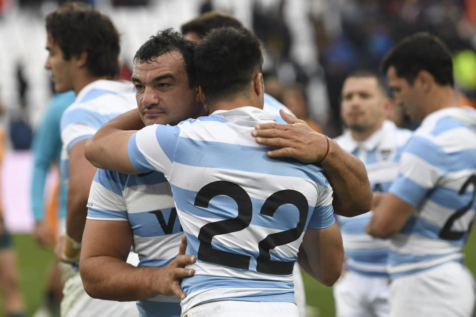 Argentina's Agustin Creevy embraces his teammate Tomas Albornoz after losing a rugby match championship to Australia, in Mendoza, Argentina, Saturday, Aug. 6, 2022. (AP Photo/Gustavo Garello)