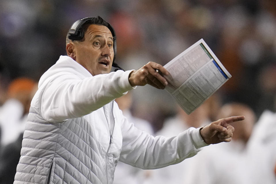 Texas head coach Steve Sarkisian talks to his team during the first half of an NCAA college football game against TCU, Saturday, Nov. 11, 2023, in Fort Worth, Texas. (AP Photo/Julio Cortez)