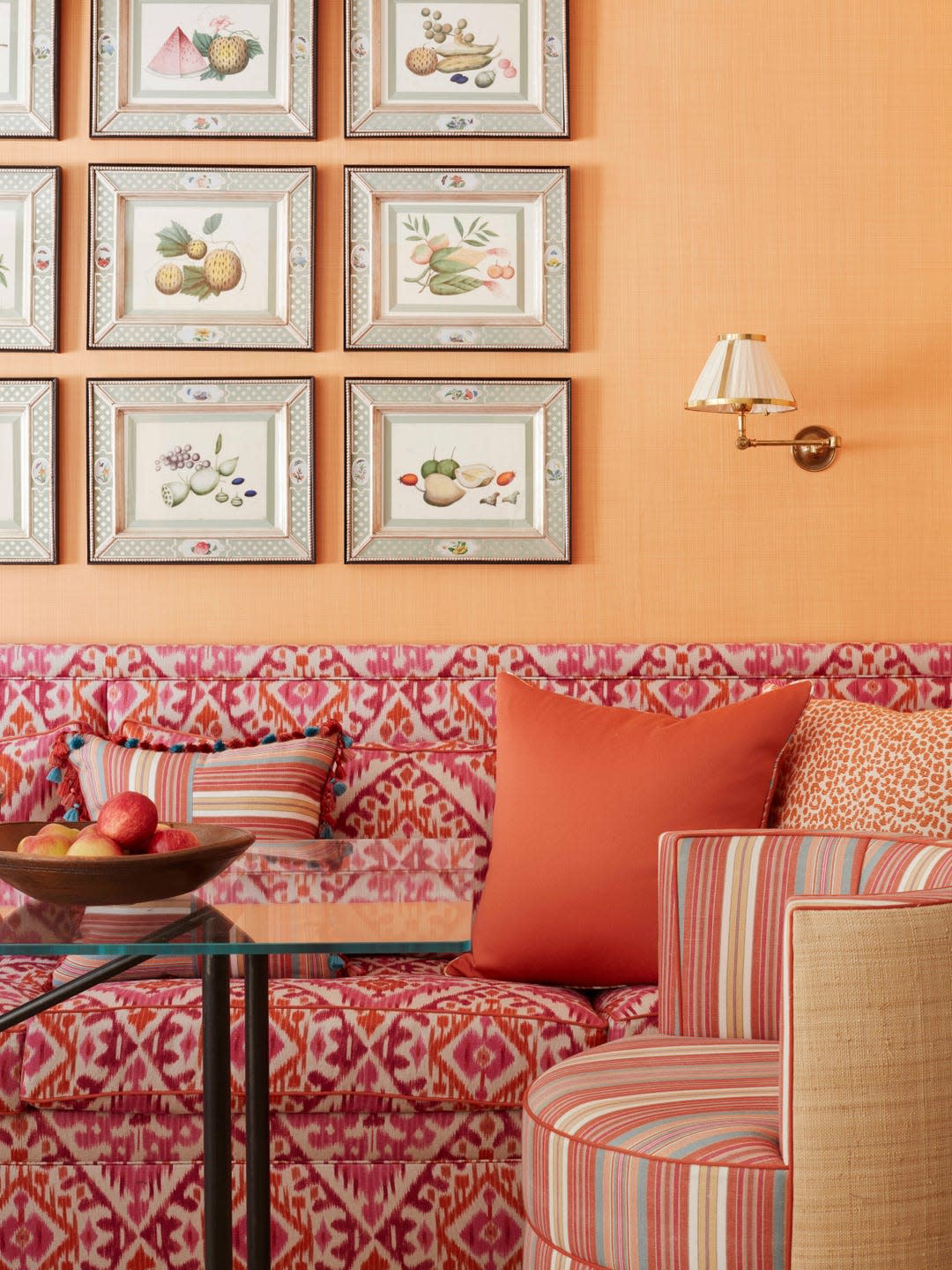 in the breakfast room low hanging fruit arrives in a series of 19th century chinese watercolors hung above a banquette in pink and orange fabric