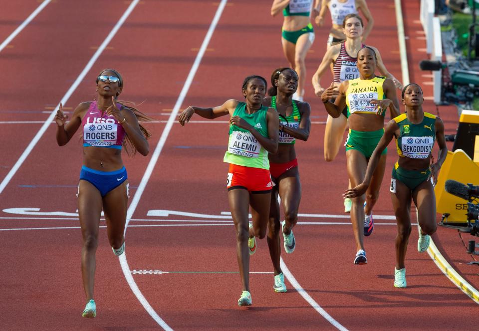 USA's Raevyn Rogers, left, wins her heat of the women's 800 meters on day seven of the World Athletics Championships in Eugene, Ore. Thursday, July 21, 2022.