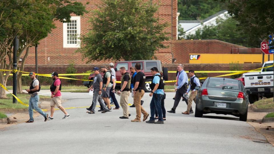 <div class="inline-image__caption"><p>"Police work the scene where eleven people were killed during a mass shooting at the Virginia Beach city public works building, Friday, May 31, 2019 in Virginia Beach, Va. A longtime, disgruntled city employee opened fire at a municipal building in Virginia Beach on Friday, killing 11 people before police fatally shot him, authorities said. Six other people were wounded in the shooting, including a police officer whose bulletproof vest saved his life, said Virginia Beach Police Chief James Cervera. </p></div> <div class="inline-image__credit">L. Todd Spencer/The Virginian-Pilot/AP</div>