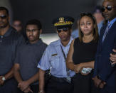 Shawn Gregoire, second from right, mother of U.S. Army Spc. Michael Nance, along with his brother and father, far left, and others watch as a U.S. Army carry team moves the transfer case containing the remains of Nance during a dignified transfer at Chicago Midway International Airport, Friday, Aug. 9, 2019, in Chicago. Nance died July 29 of wounds sustained in a combat-related incident in Tarin Kowt, in southern Afghanistan. (Zbigniew Bzdak/Chicago Tribune via AP, Pool)