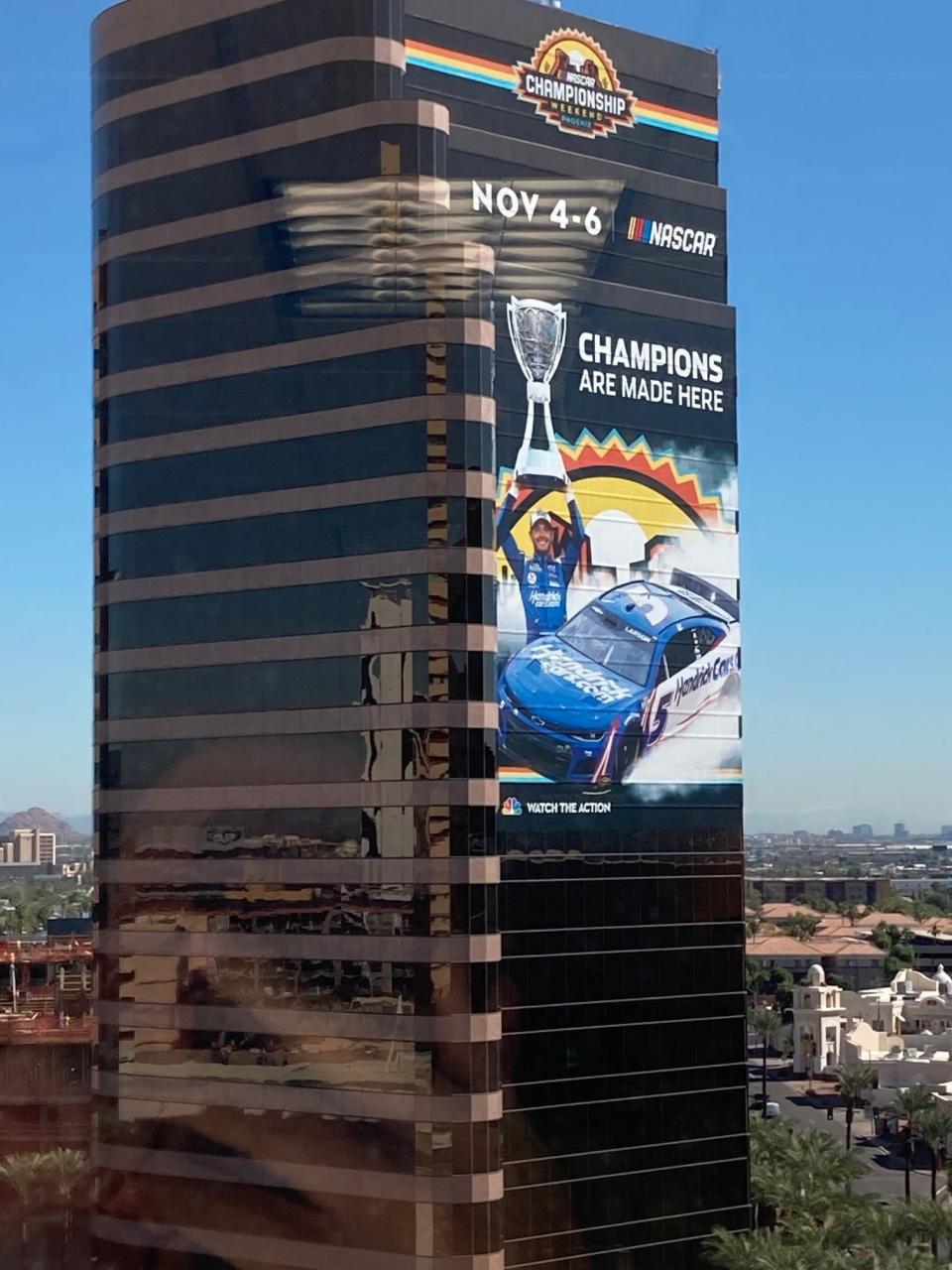 Cutting-edge 3D billboards like this one of Kyle Larson can be seen in downtown Phoenix promoting this weekend's NASCAR championship races.