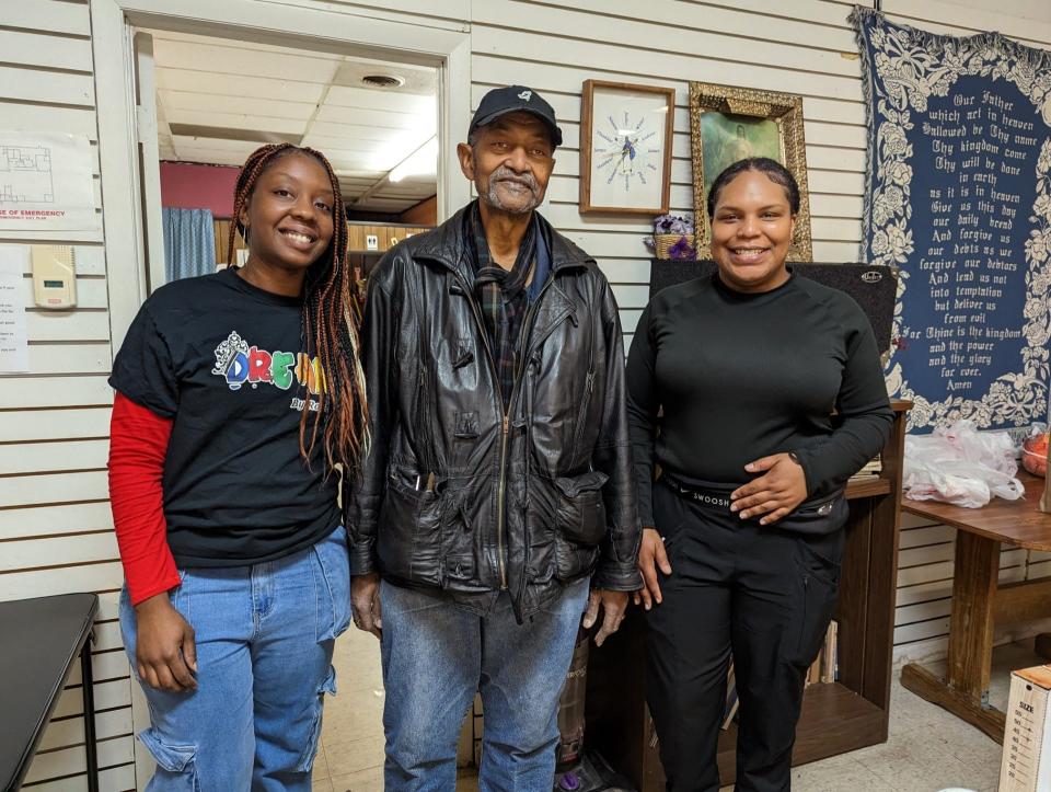Destiny Harde, the Rev. Raphael "Ray" Cox and Amirah Harde, at the Drop-In Center/Light of Christ Church in Canton, where Destiny Harde's ministry, DreamByRoyal, recently hosted a Thanksgiving Food Drive.