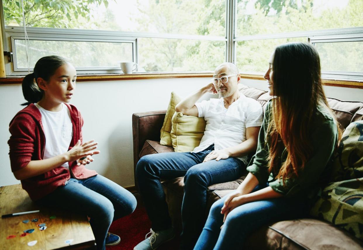 <span class="caption">Kids learn who they are and how to cope within their families.</span> <span class="attribution"><a class="link " href="https://www.gettyimages.com/detail/photo/father-in-discussion-with-daughters-before-school-royalty-free-image/671716337" rel="nofollow noopener" target="_blank" data-ylk="slk:Thomas Barwick/Stone via Getty Images;elm:context_link;itc:0;sec:content-canvas">Thomas Barwick/Stone via Getty Images</a></span>