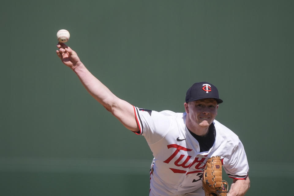 Minnesota Twins starting pitcher Louie Varland throws in the first inning of a spring training baseball game against the Pittsburgh Pirates in Fort Myers, Fla., Saturday, Feb. 24, 2024. (AP Photo/Gerald Herbert)