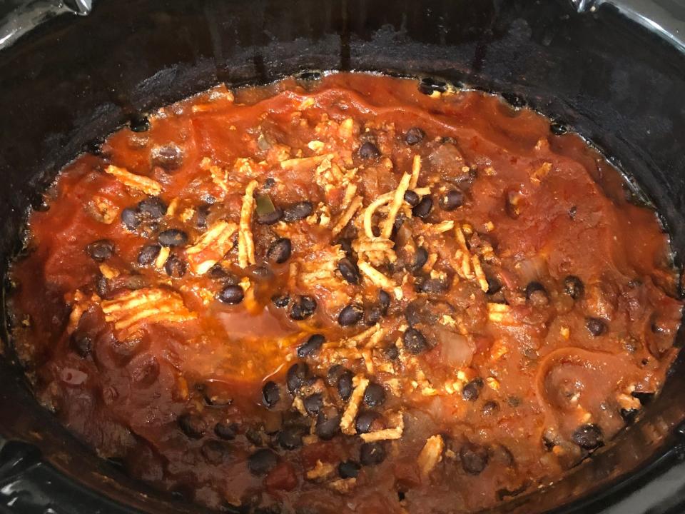 A Crock-Pot filled with cooked turkey chili.