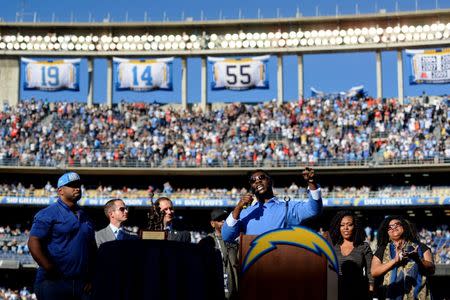 Nov 22, 2015; San Diego, CA, USA; San Diego Chargers former running back LaDainian Tomlinson gestures as he talks to the fans before his number 21 is retired and included into the Charters Ring of Honor during halftime against the Kansas City Chiefs at Qualcomm Stadium. Mandatory Credit: Jake Roth-USA TODAY Sports