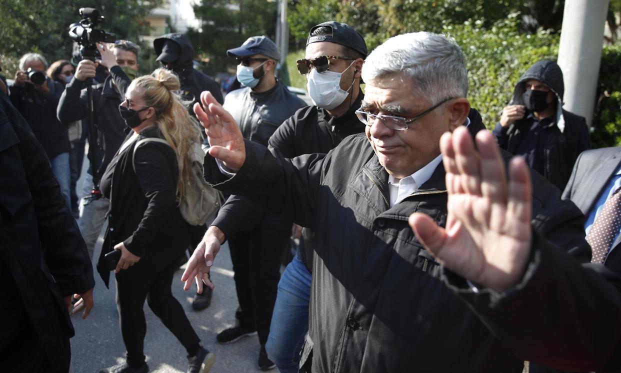 <span>Nikos Michaloliakos leaving his house in Athens after his conviction in 2020.</span><span>Photograph: Thanassis Stavrakis/AP</span>