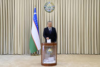 Uzbek President Shavkat Mirziyoyev casts his ballot at a polling station during the presidential election in Tashkent, Uzbekistan, Sunday, Oct. 24, 2021. Uzbeks voted Sunday in a presidential election that the incumbent is expected to win in a landslide against weak competition. Although Shavkat Mirziyoyev has relaxed many of the policies of his dictatorial predecessor, he has made little effort at political reform. He took office in 2016 upon the death of Islam Karimov and faces four relatively low-visibility candidates who did not even show up for televised debates. (Uzbekistan Presidential Press Service Pool photo via AP)