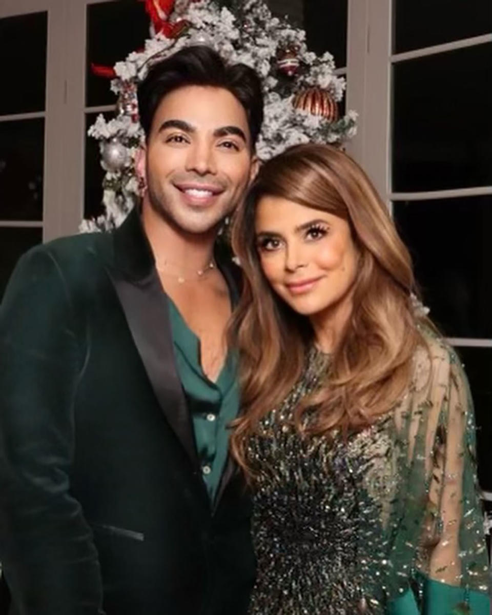 Paula Abdul with a heavy filter and makeup on with a party guest 
