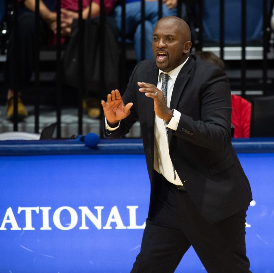 University of Southern Indiana Head Coach Stan Gouard communicates with players during the University of Southern Indiana Screaming Eagles vs Southern Illinois Salukis game at Screaming Eagles Arena in Evansville, Ind., Sunday afternoon, Nov. 13, 2022. 