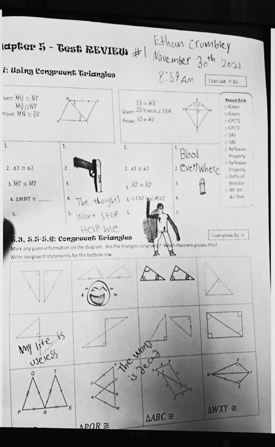 A drawing that Ethan Crumbley made during class time at Oxford High School is displayed during Jennifer Crumbley's trial at Oakland County Courthouse, Tuesday, Jan. 30, 2024, in Pontiac, Mich. Jennifer Crumbley, 45, is charged with involuntary manslaughter. Prosecutors say she and her husband were grossly negligent and could have prevented the four deaths if they had tended to their son’s mental health. They’re also accused of making a gun accessible at home. (Clarence Tabb Jr./Detroit News via AP)