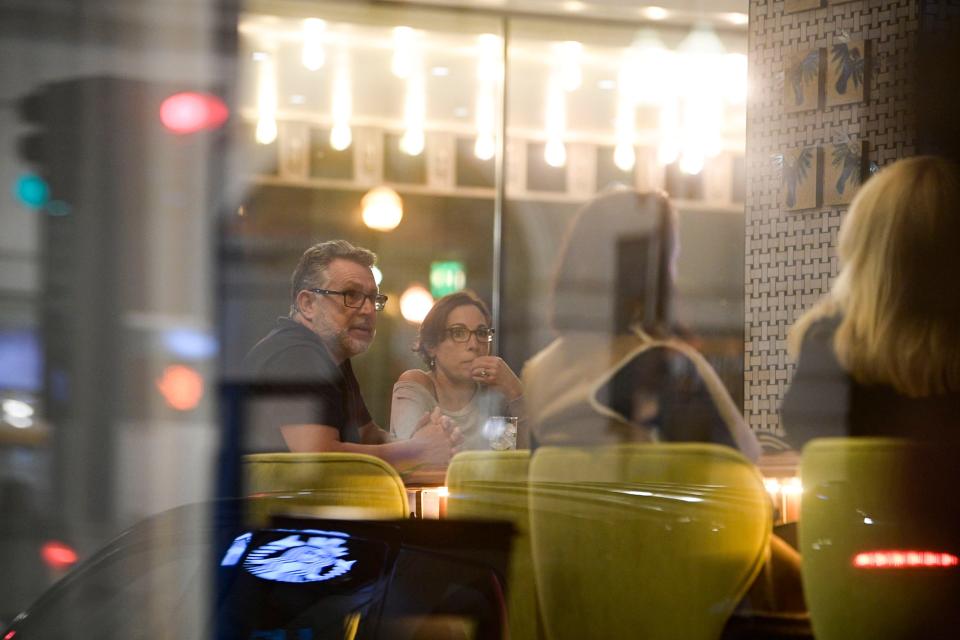 Visitors chat at The Bar inside the Hyatt Place in downtown Knoxville, Tenn. on Friday, March 11, 2022.