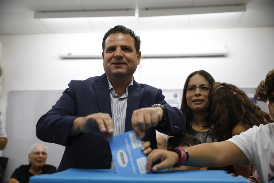 Israeli Arab politician Ayman Odeh casts his vote in Haifa, Israel, Tuesday, Sept. 17, 2019. Israelis began voting Tuesday in an unprecedented repeat election that will decide whether longtime Prime Minister Benjamin Netanyahu stays in power despite a looming indictment on corruption charges. (AP Photo/Ariel Schalit)