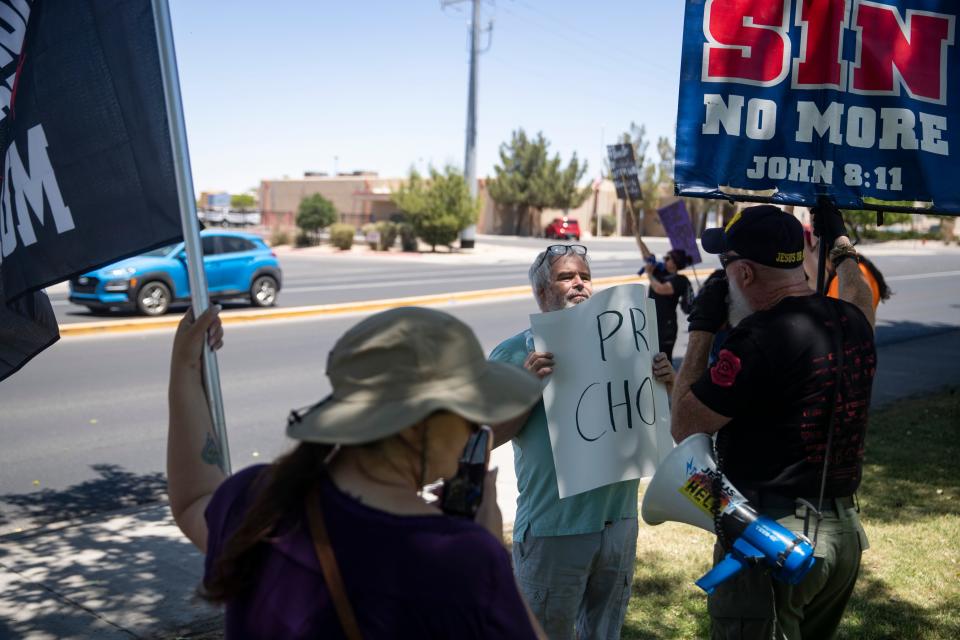 An abortion rights demonstrator and an anti-abortion demonstrator argue at Albert Johnson Park near City Hall in Las Cruces, N.M. to protest the looming Roe v. Wade decision on Saturday, May 14, 2022. This protest is part of a larger, national rally called Bans Off Our Bodies organized by Planned Parenthood.