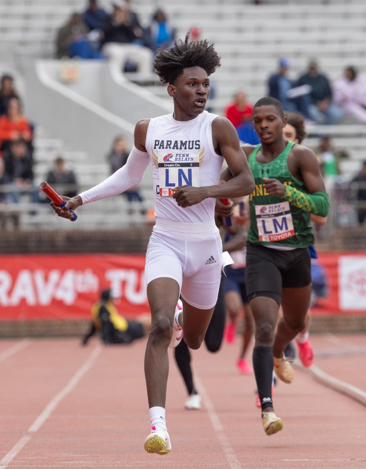 Paramus' Corey Sander runs the anchor leg of his school's winning High School Boys 4X 400 Relay effort