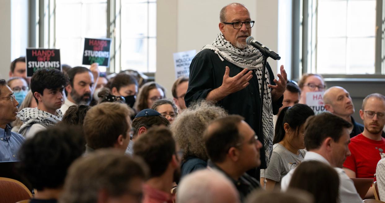 Samer Alatout, an associate professor in the department of community and environmental sociology, speaks in support of pro-Palestinian protesters during a faculty senate meeting Monday at the University of Wisconsin-Madison. Pro-Palestinian protesters have vowed to stay camped on Library Mall until their demands are met for UW-Madison to divest from companies with ties to Israel. Over 50 tents remained on the mall on Monday.