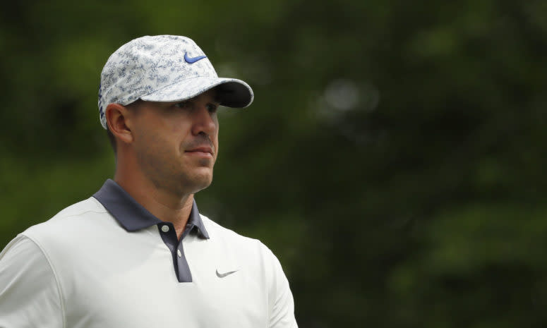 A closeup of Brooks Koepka on the golf course.