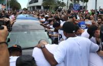 <p>Miami Marlins players and members of the Marlins organization and their fans surround the hearse carrying Miami Marlins pitcher Jose Fernandez to pay their respects on September 28, 2016 in Miami, Florida. Mr. Fernandez was killed in a weekend boat crash in Miami Beach along with two friends. (Photo by Joe Raedle/Getty Images) </p>