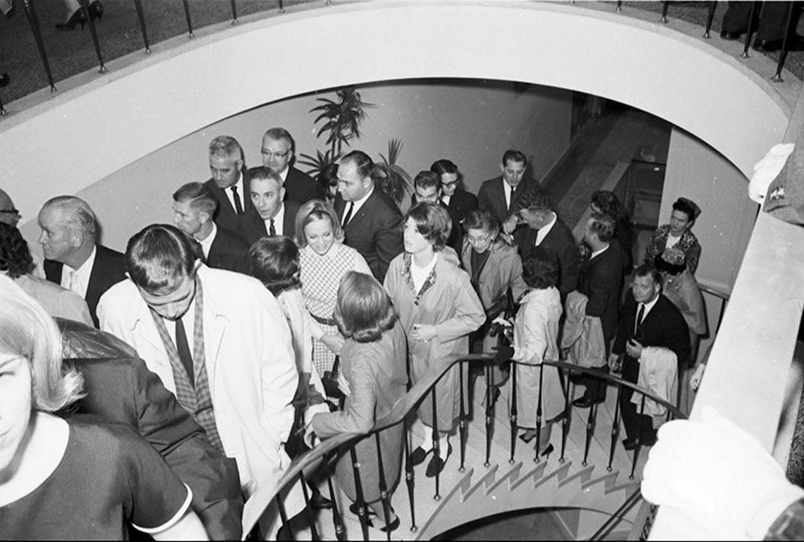 People climbing the lobby stairway at Hotel Texas to attend the breakfast for President John F. Kennedy and his party, 11/22/1963