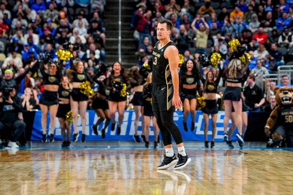 Oakland Golden Grizzlies guard Jack Gohlke (3) celebrates shooting a 3-pointer in the first round of the 2024 NCAA Tournament at PPG Paints Arena in Pittsburgh, Pennsylvania on Thursday, March 21, 2024.