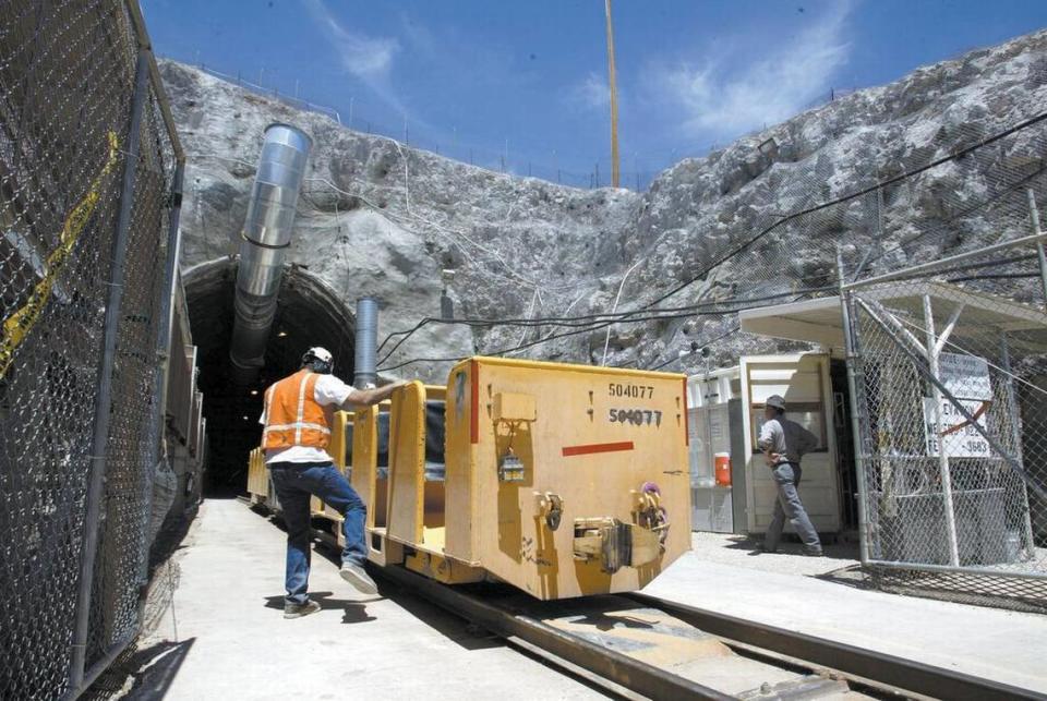 A 2002 photo shows a worker boarding a train car that leads into the Yucca Mountain radioactive waste disposal site, which was to have been a “deep repository” for the nation’s stockpile of spent nuclear fuel. CHUCK KENNEDY/KRT