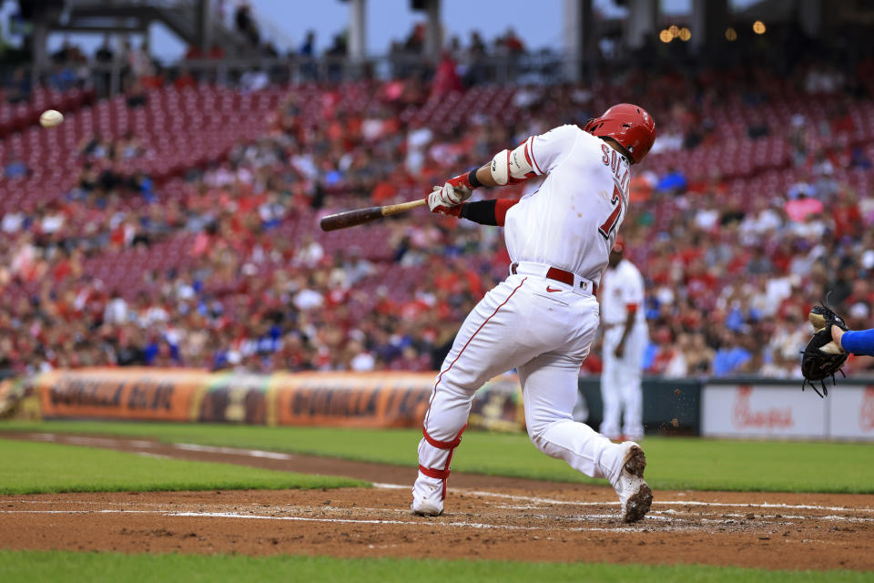 Cincinnati Reds' Donovan Solano hits an RBI double during the second inning of the team's baseball game against the Los Angeles Dodgers in Cincinnati, Wednesday, June 22, 2022. (AP Photo/Aaron Doster)