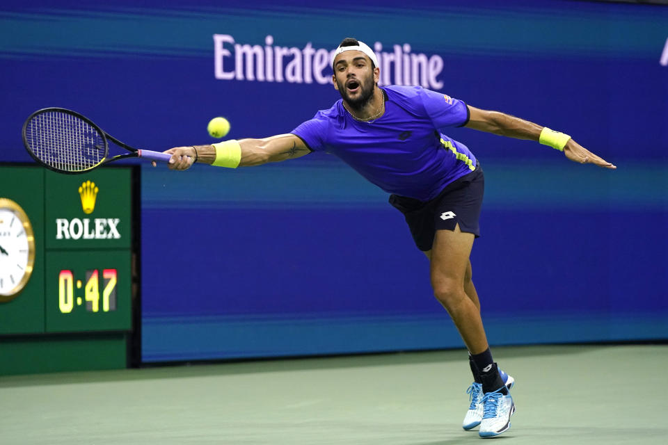 Matteo Berrettini, of Italy, returns against Novak Djokovic, of Serbia, during the quarterfinals of the U.S. Open tennis tournament, Wednesday, Sept. 8, 2021, in New York. (AP Photo/Frank Franklin II)