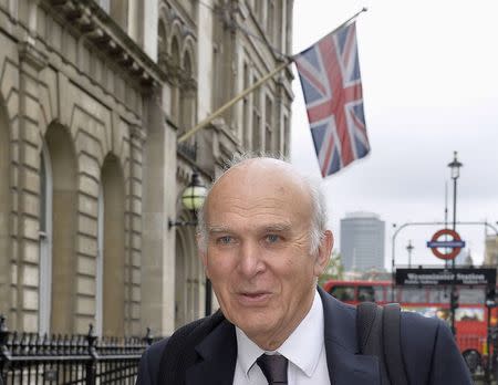 Britain's Business Secretary Vince Cable leaves Portcullis House ahead of a parliamentary business and enterprise committee hearing on the future of AstraZeneca, in central London, May 13, 2014. REUTERS/Toby Melville