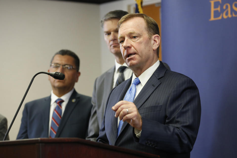 McGregor Scott, the United States Attorney for the Eastern District of California, answers questions concerning the charges against leaders of the white supremacist prison gang, the Aryan Brotherhood, during a news conference in Sacramento, Thursday, June 6, 2019. Aryan Brotherhood members and associates are accused of running a criminal enterprise using contraband cellphones, encrypted chats, text messages, multimedia messages and email.The charges detail five slayings and accuse an attorney of helping smuggle drugs and cellphones to aid the white supremacist gang. (AP Photo/Rich Pedroncelli)