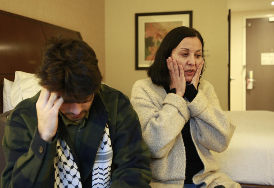 Tamara Tamimi and her son, Kinnan Abdalhamid, 20, speak about the Nov. 25, 2023, shooting that injured Kinnan and his two friends, an attack being investigated as a possible hate crime, during an interview Friday, Dec. 1, 2023, in Burlington Vt. The three friends, all college students of Palestinian descent, were shot at close range on a residential street in Burlington. (AP Photo/Hasan Jamali)