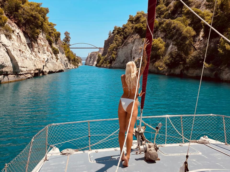 Woman on boat on turquoise waters