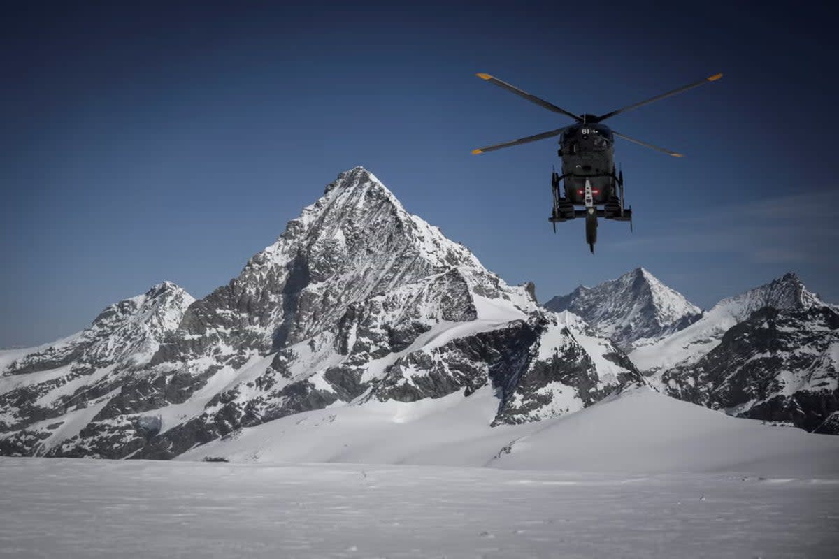 A helicopter heads towards the Matterhorn (AFP via Getty Images)