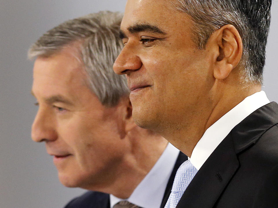 CEOs of Deutsche Bank Anshu Jain, right, and Juergen Fitschen stand together prior to the annual press conference in Frankfurt, Germany, Wednesday, Jan. 29, 2014. Germany's biggest bank had a surprise loss of 965 million euros (US dollar 1.32 billion) in the fourth quarter, as earnings were burdened by 528 million in costs for court settlements and investigations into alleged past misconduct in the fourth quarter. (AP Photo/Michael Probst)