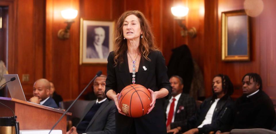 Joshua Holloway’s lawyer, Rebecca Adelman, uses a basketball as part of her demonstration during her opening statement during a hearing about the involvement in an incident with Ja Morant at Morant’s home in Eads, Tenn, on Monday December 11, 2023 at Shelby County Circuit Court in Memphis,Tenn.