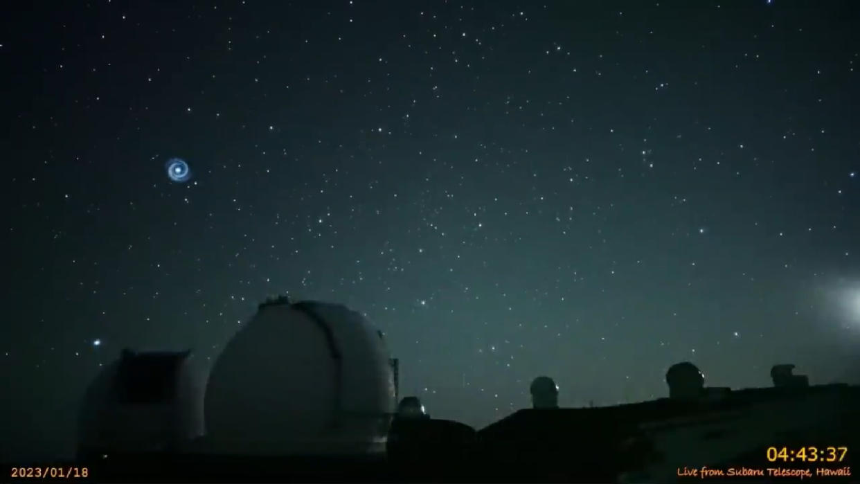  A shot of the spiral-shaped light in the sky above Hawaii captured Jan. 18 by the Subaru-Asahi Star Camera on Mauna Kea.  